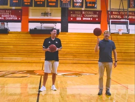Stephen McCauley participating in a student basketball partnership